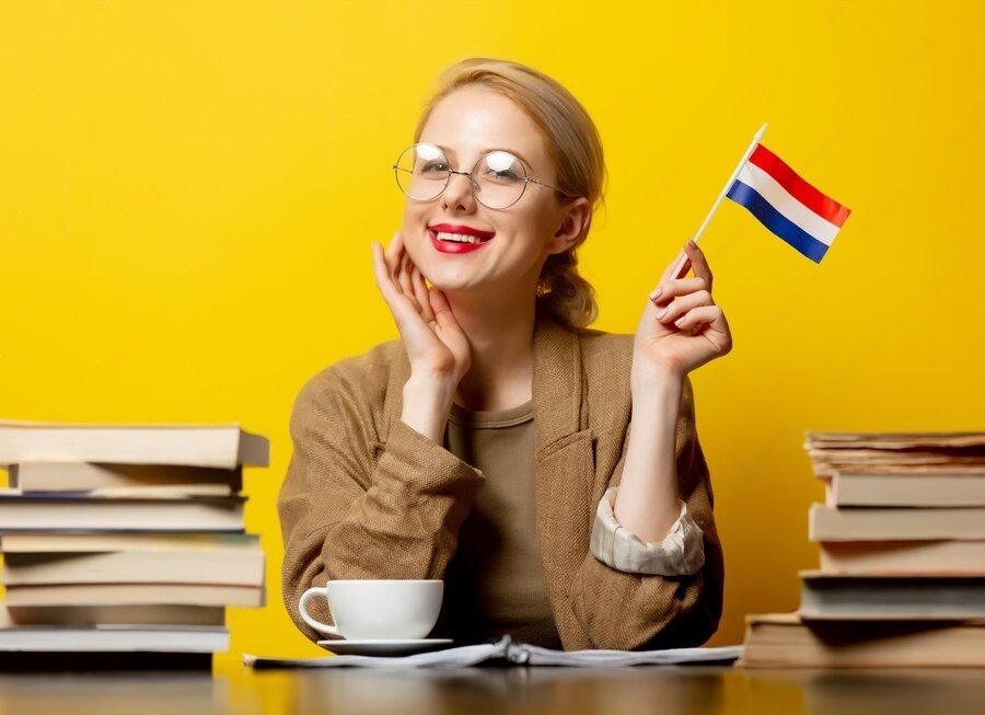 style-blonde-womansitting-table-with-books-flag-netherlands-yellow_87910-6708-transformed